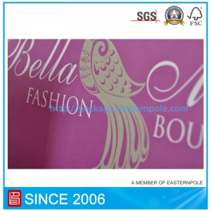 كيس من الورق الأرجواني مع مقبض معقود